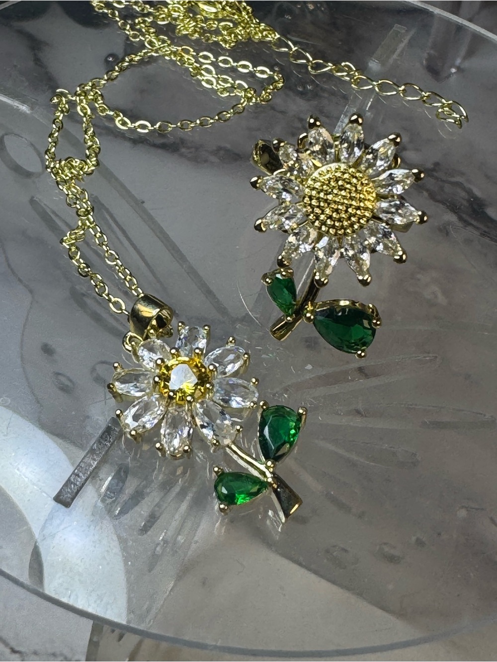 Gold Plated Daisy Pendant Necklace with Green Crystal Leaves and Spinning Ring - Picture 2 of 2
